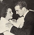 Liz Taylor fixes Montgomery Clift's tie, 1949